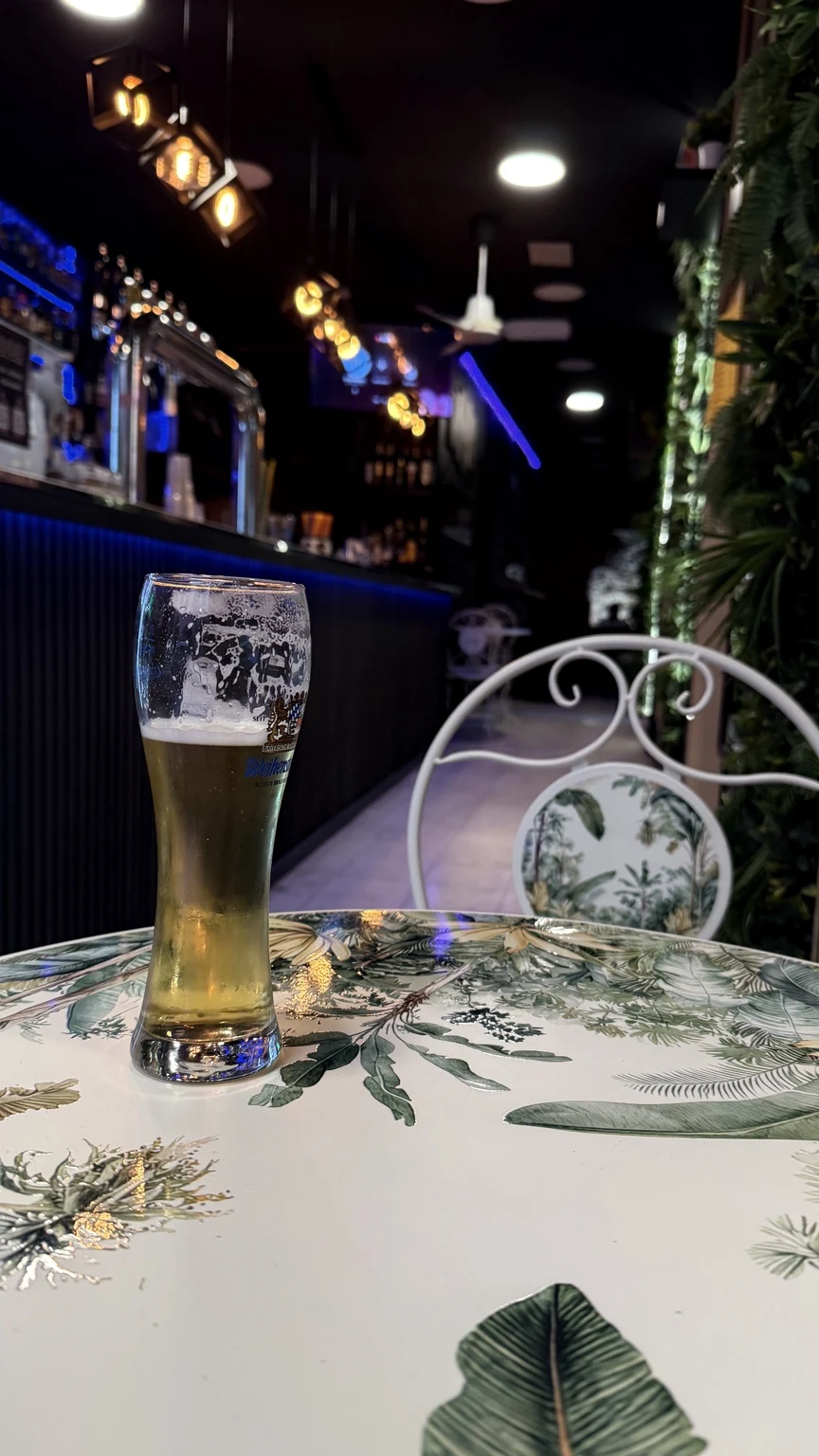 A beer and the blue-lit Jimmy bar